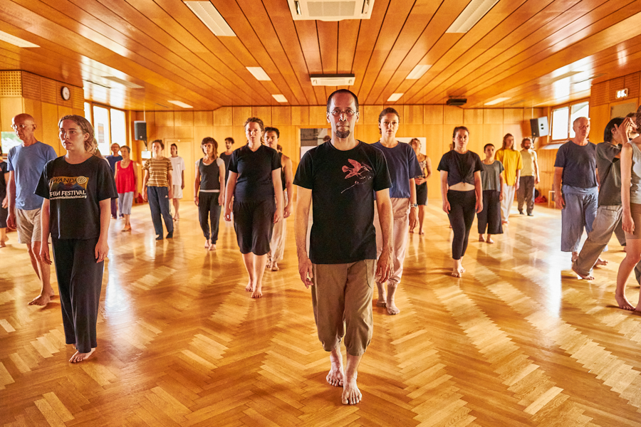 Shinichi and participants standing.